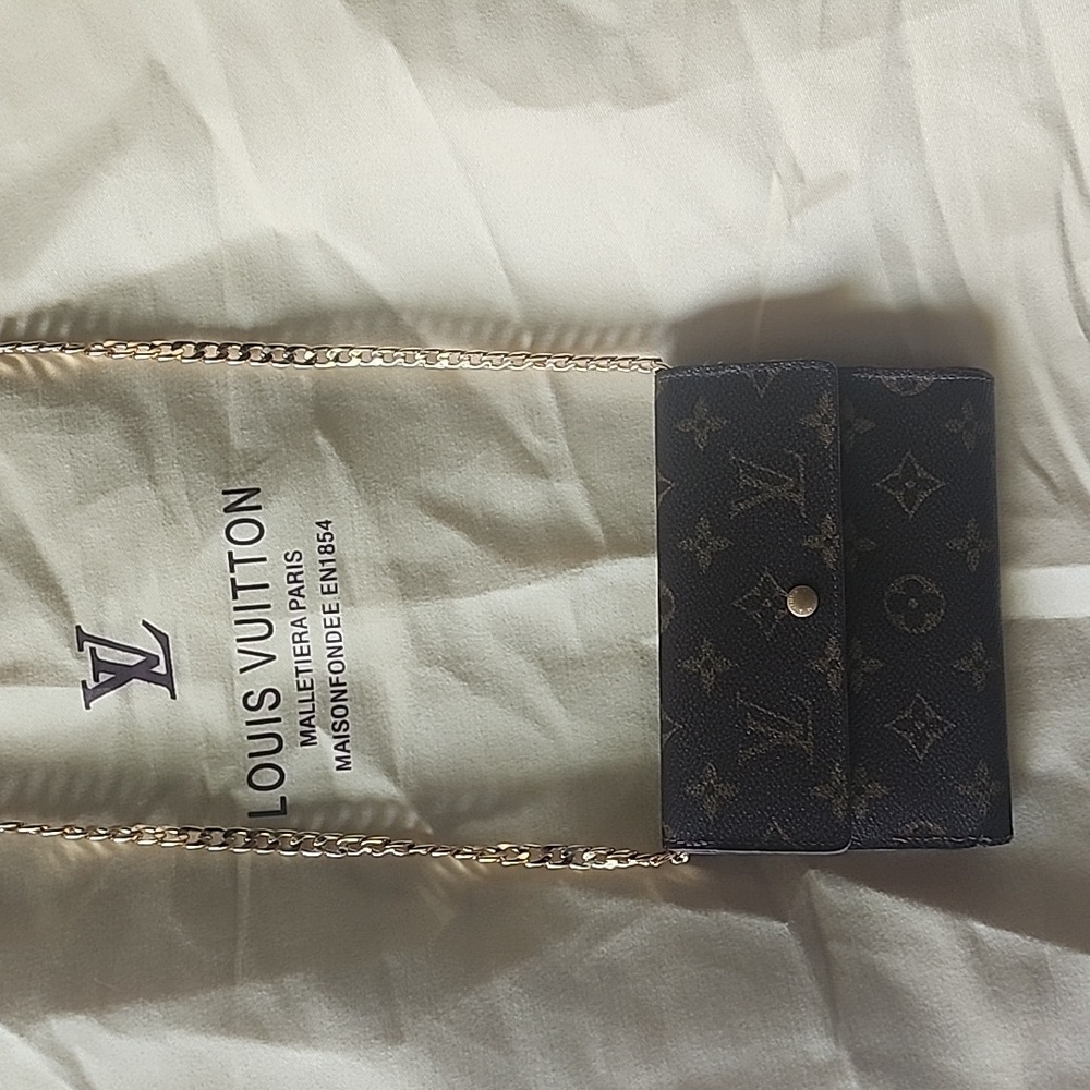 Vintage Louis Vuitton monogram wallet. gold chain not included.